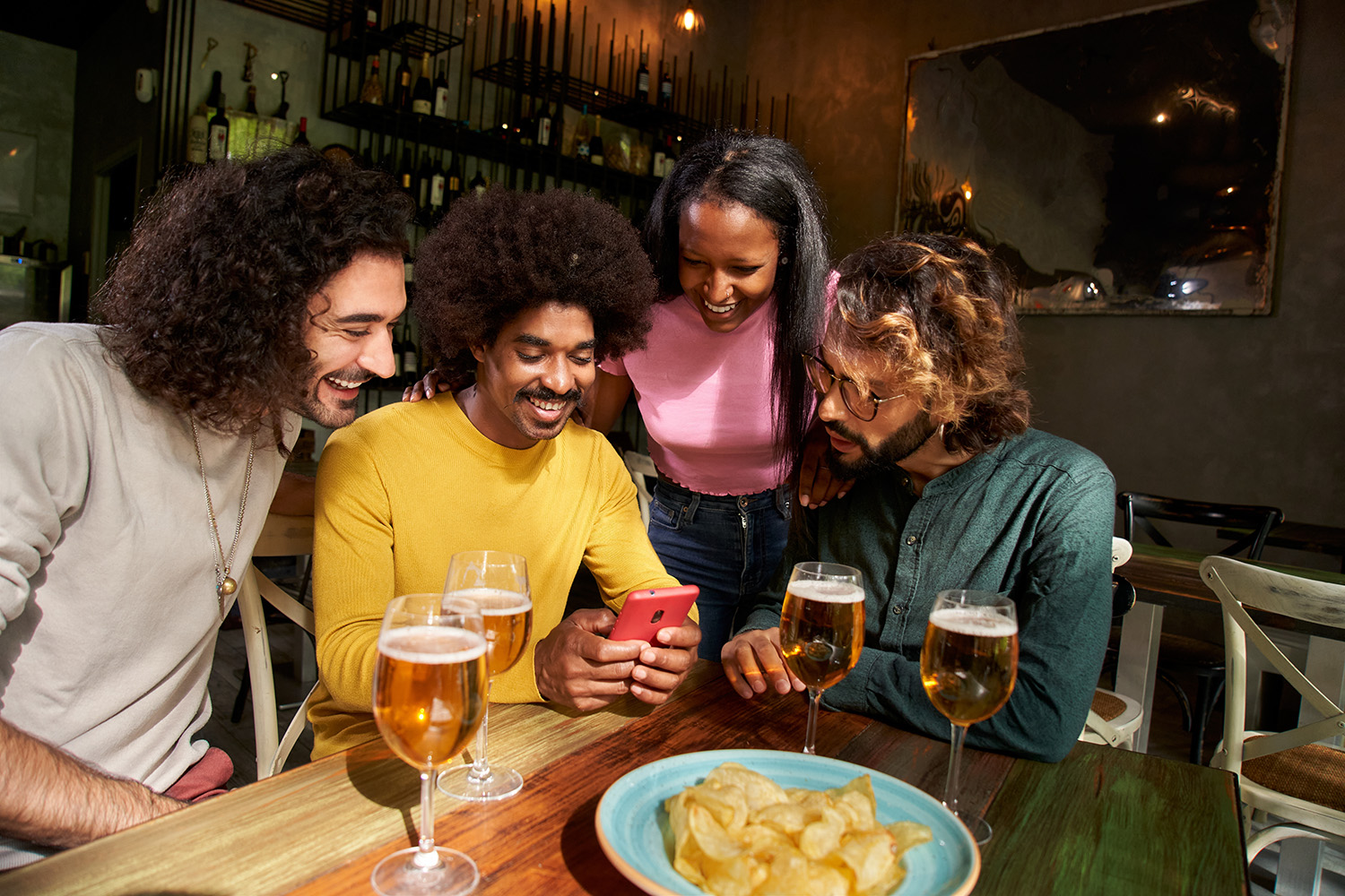 Team collaborating over a phone at a table